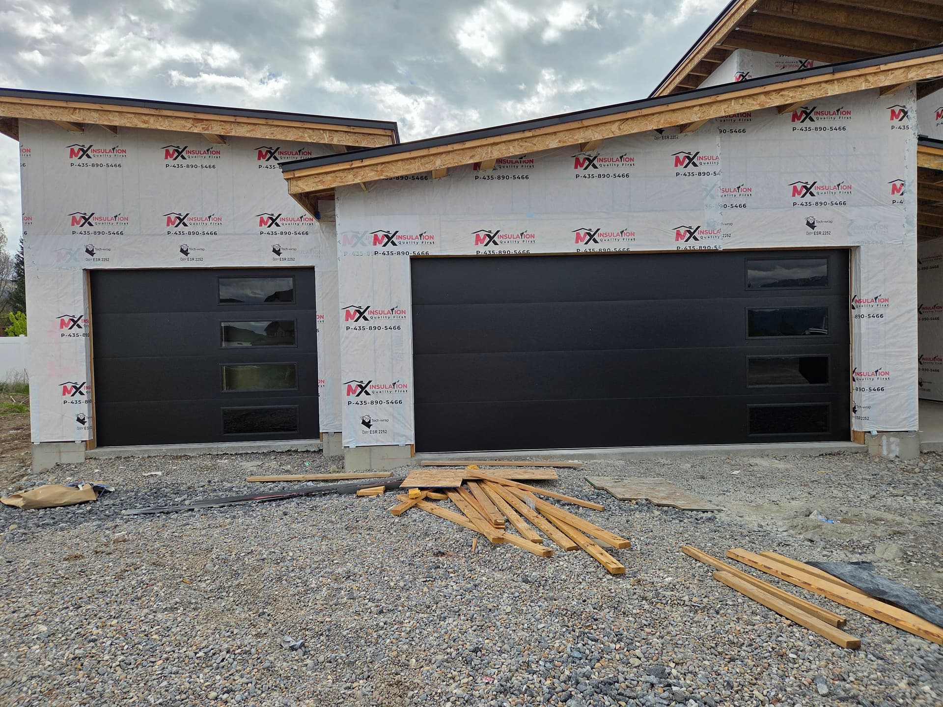 Black Flush Panel Garage Doors with Midnight Gray Glass in Nibley image