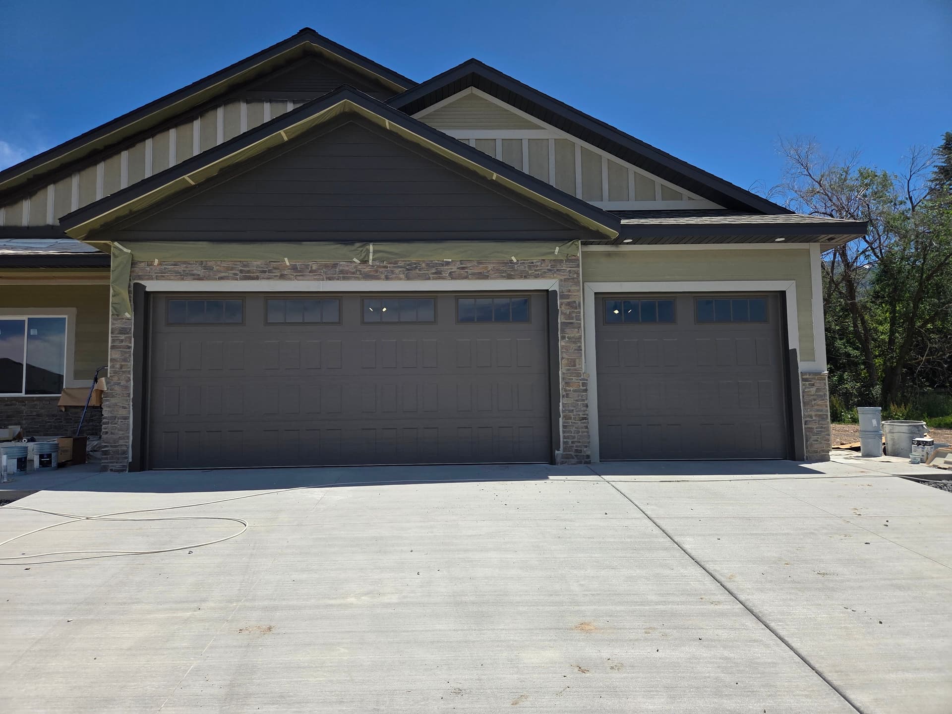 Bronze Extended Panel Garage Doors Installed in North Logan image