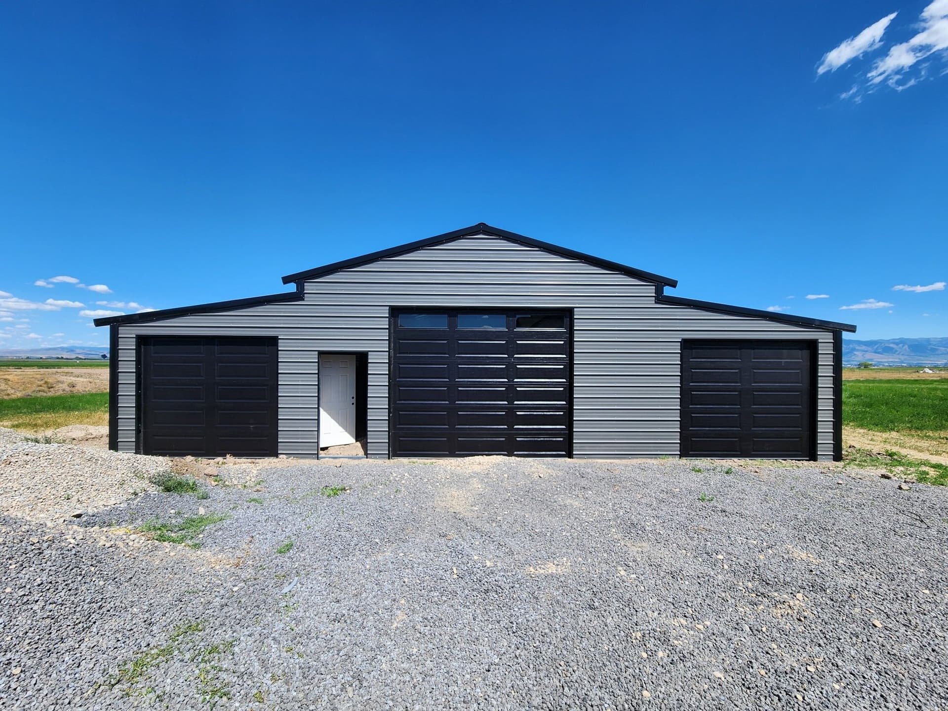 Sleek Roll-Up Doors Installed on Metal Barn image